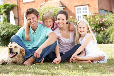 image of family sitting on lawn