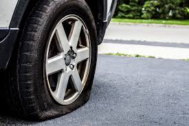 image of car with flat tire